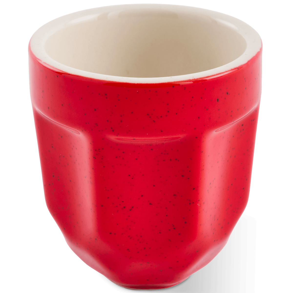 A red porcelain espresso cup with a textured speckled finish and a contrasting cream-colored interior