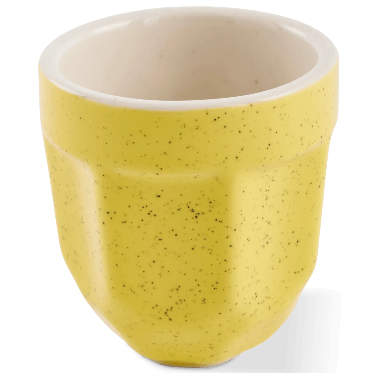 A small yellow porcelain cup with a speckled exterior and a smooth off-white interior
