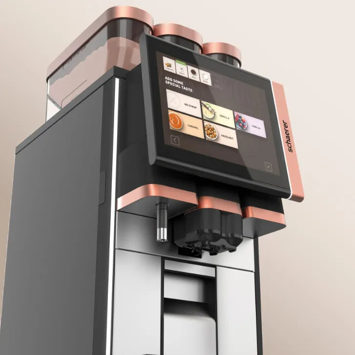 Modern coffee machine with a digital display on a beige background